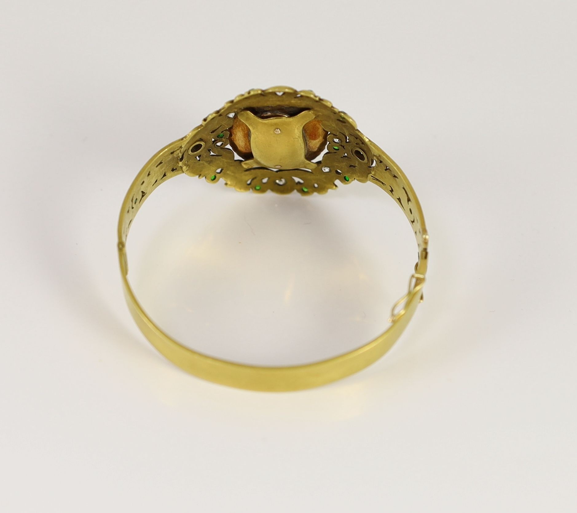 A Victorian gold, sardonyx cameo, split pearl, diamond and demantoid garnet set hinged bangle